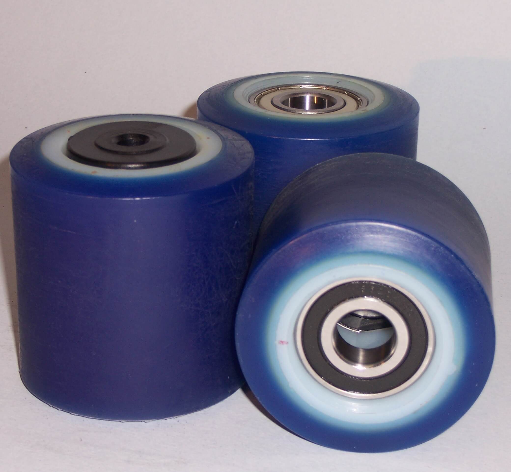 Wheels series RO ROLL-ADINYL SOFT - Rollers with cast soft polyurethane coating 87 Sh. A polyamide 6 center. Available with standard or stainless steel ball bearings.  Some feature semibushes with extra bearing shield/protection.